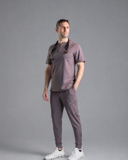 Man in gray athletic outfit with stethoscope.